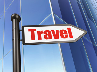 Tourism concept: sign Travel on Building background