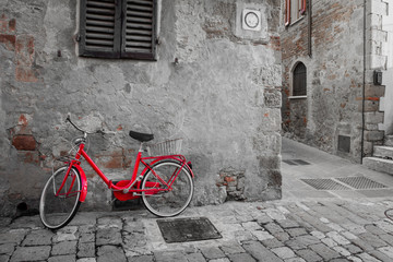 Historical Mediterranean town street with red bike