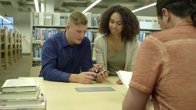Students using cellphone in library