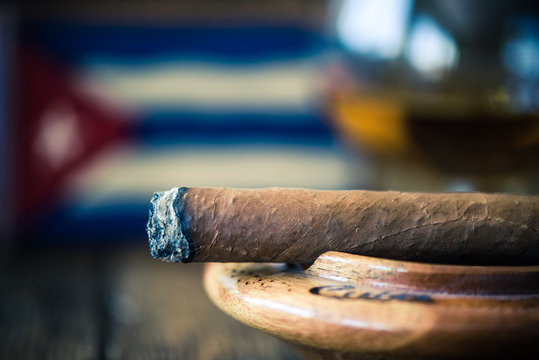 smoking cuna cigar in ashtray