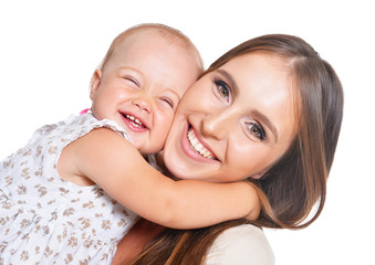 Woman with little daughter on a white