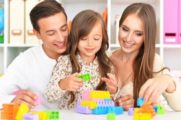 Happy family playing at home