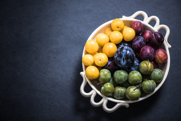 bowl with plums, autumn seasonal fruit
