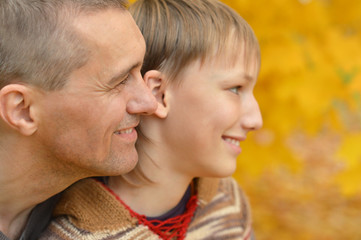 Fototapeta premium Father and son in autumn