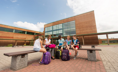 group of happy elementary school students outdoors