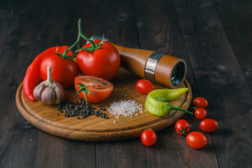 Fresh tomatoes and coarse salt for use as cooking ingredients wi