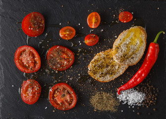 Fresh tomato on black background