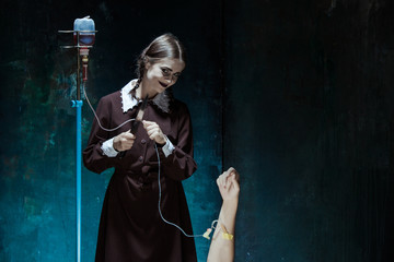 Portrait of a young girl in school uniform as killer woman