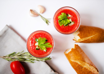 Gazpacho in glasses on a light background