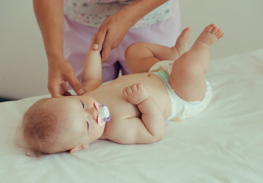 Masseur doing massage a small baby.
