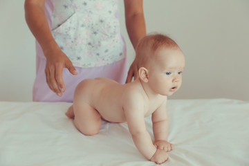 Four months old baby enjoying massage