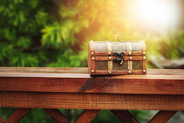 Closed wooden chest box outdoors in nature