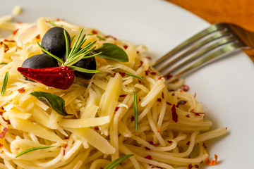 Spaghetti aglio e olio - Spaghetti aglio e olio in white plate.