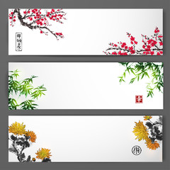 Three banners with blossoming sakura, bamboo and chrysanthemum. Traditional oriental ink painting sumi-e, u-sin, go-hua. Contains hieroglyphs - zen, freedom, nature, happiness, luck