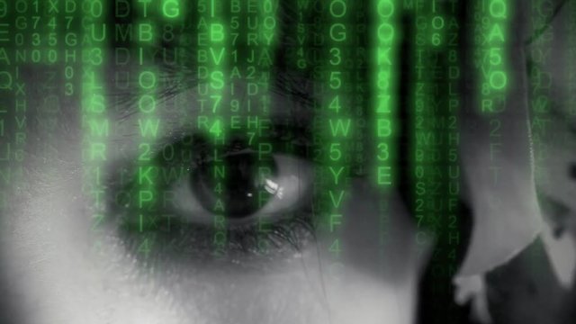 Matrix sci-fi code rain falling over a woman's eye looking in camera. Mystery, sensuality, technology. Film noir style.
