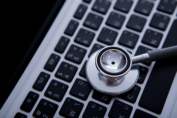 stethoscope on laptop