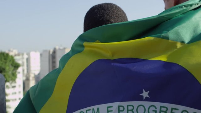 Children waving brazilian flag