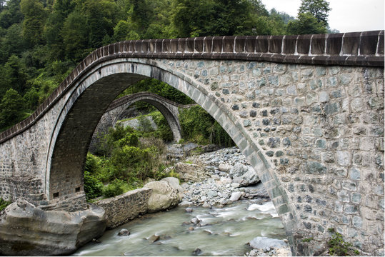 old stone bridge on river
