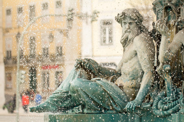 rossio square fountain in lisbon © santiago silver