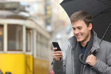 Man reading message in a smart phone