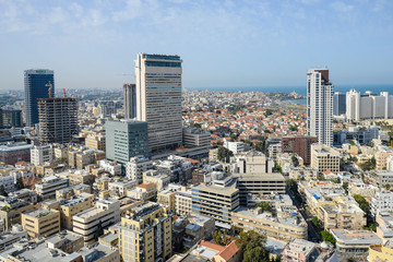 Fototapeta premium Panoramic view on roofs of Tel-Aviv on the modern buildings bac