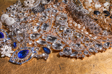 Close up of luxury precious jewelry on golden background