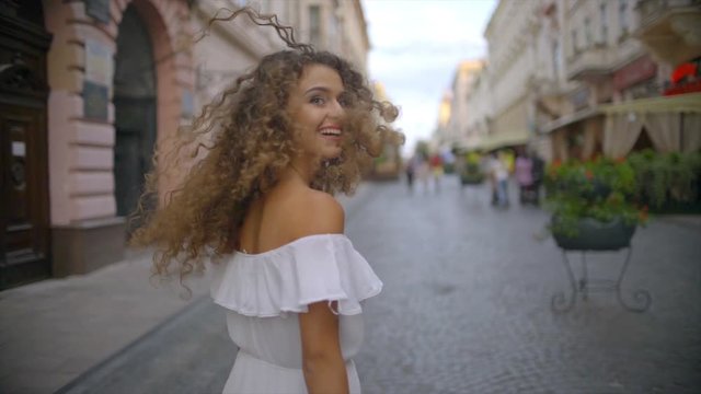 3 in 1! The beautiful woman walk along the restaurant terrace. Slow motion. Wide angle 