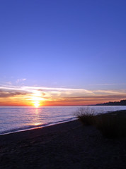The sun going down over a lake, with space for text.