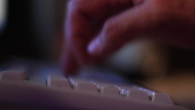 Extreme close up of pressing keyboard buttons 
