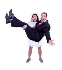 Bride carries in his hands groom isolated on white background