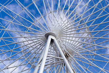 Ferris wheel against the blue sky