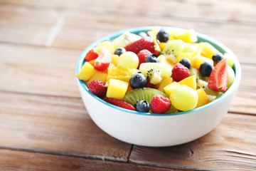 Fresh fruit salad on a brown wooden table