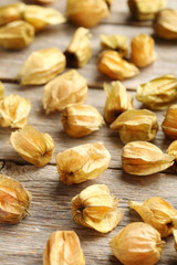 Ripe physalis on a grey wooden table
