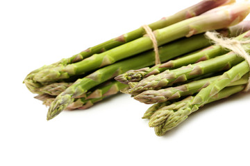 Fresh green asparagus isolated on a white