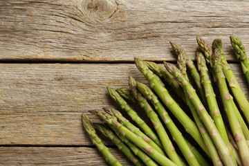 Fresh green asparagus on a grey wooden table