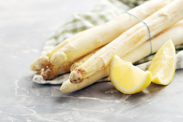 Fresh white asparagus on a grey table