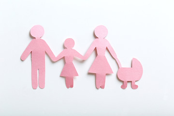 Happy paper family on white background