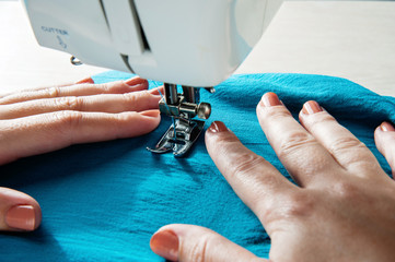 Sewing machine with hands of a tailor