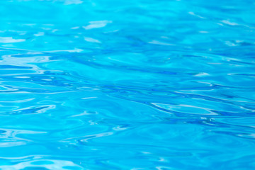 Fototapeta na wymiar expanse of blue water in the pool as a background