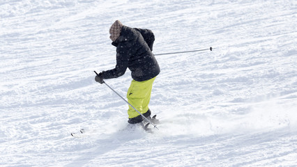 Athlete skiing in the snowy mountains