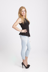 Fototapeta premium stylish young woman posing in clear background