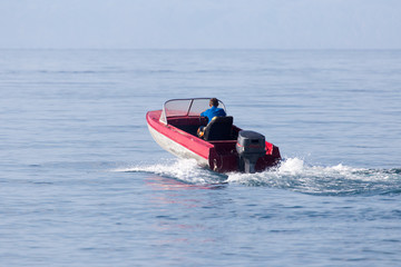 Fototapeta na wymiar motor boat on the water at a speed of