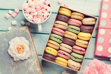 Colorful macaroons in a box and marshmallow