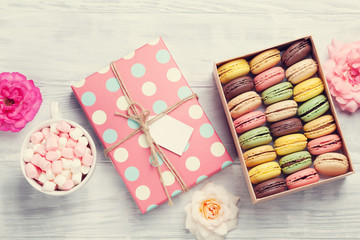 Colorful macaroons in a box and marshmallow