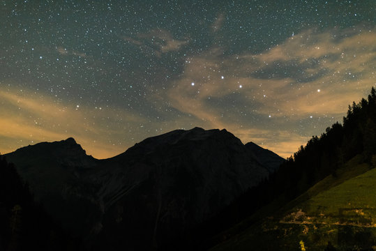 Starry night sky over the mountains of Tyrol Austria