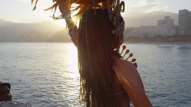 Woman dressed in carnival costume dancing