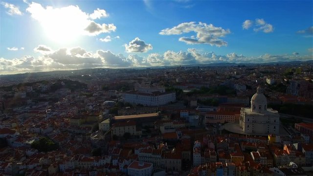 Portugal 4k travel video background. Aerial drone view of old city Lisbon, Alfama. Houses, architecture, Tejo river, brige, sun shine, sky clouds
