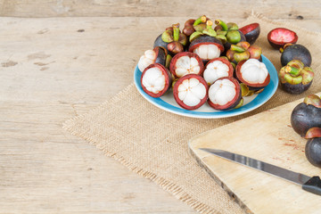 Mangosteen on wood table.