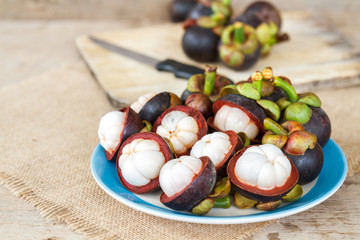 Mangosteen on wood table.
