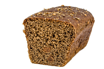 Cut in half a loaf of bread made of dark flour, isolated on whit